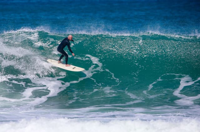 Luke Darby surfing on Auckland's West Coast.
